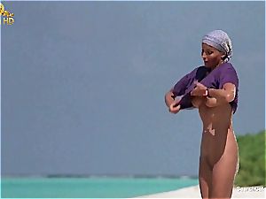 fantastic Bo Derek demonstrating off her furry cooch at the beach